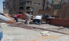 إزالة أعمال بناء مخالفة بشارع يوسف الريني