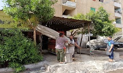 حملة لرفع إشغالات المحال التجارية ببعض المناطق بالحي