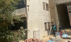 أعمال دهان للعقارات المطلة على ميدان الألف مسكن والسوق الجديد