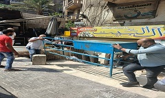 حملة لرفع الإشغالات من شوارع الحي