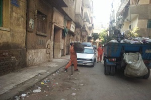 أعمال نظافة بالدرب الأحمر