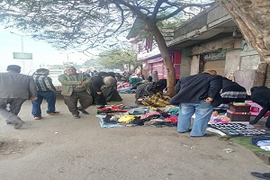 حملة لرفع الإشغالات بشارع كورنيش النيل