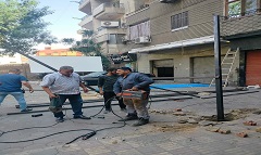 إزالة تندة مخالفة من مقهى بشارع حمدي