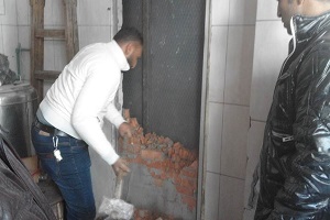 تشميع محلين وإزالة مخالفات داخل عقار بحي الموسكي