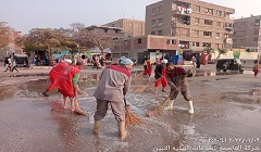 رفع تراكمات الأمطار من شوارع الحي