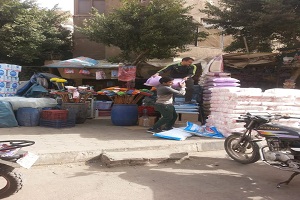 رفع إشغالات من شارع البخارى بحي غرب مدينة نصر 