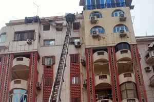 ازالة بروز بسبب سقوط جزئى اعلى عقار بشارع الاهرام